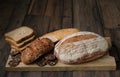 Bread. Assortment of different types of bread. Sliced Ã¢â¬ÂÃÂÃ¢â¬Â¹Ã¢â¬ÂÃÂÃ¢â¬Â¹bread on a wooden background. Loaf, bun, baguette